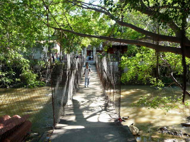 crossing the rio cuale bridge